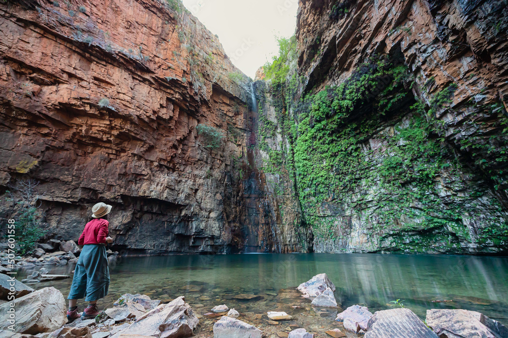 A woman is enjoying the view of Emma Gorge in Kimberley, Western Australia A woman is enjoying the view of Emma Gorge in Kimberley, Western Australia