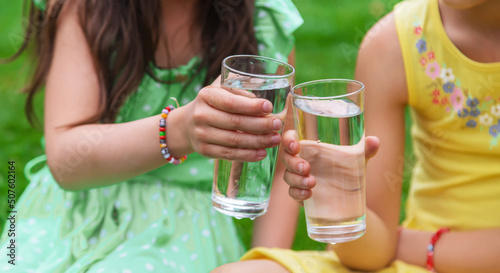 children drink clean water in nature.selective focus