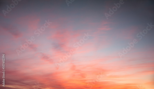 beautiful sunset sky scenery with gradient colors from orange and pink to slate blue