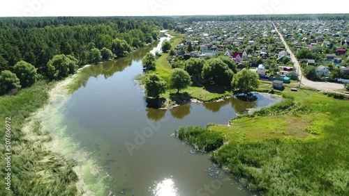 Dirty River Near the Russian Village
