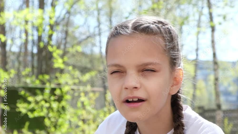 cute teenage girl squints because of poor eyesight street, child with poor eyesight selection of glasses to improve vision cute teenage girl squints because of poor eyesight street, child with poor eyesight selection of glasses to improve vision