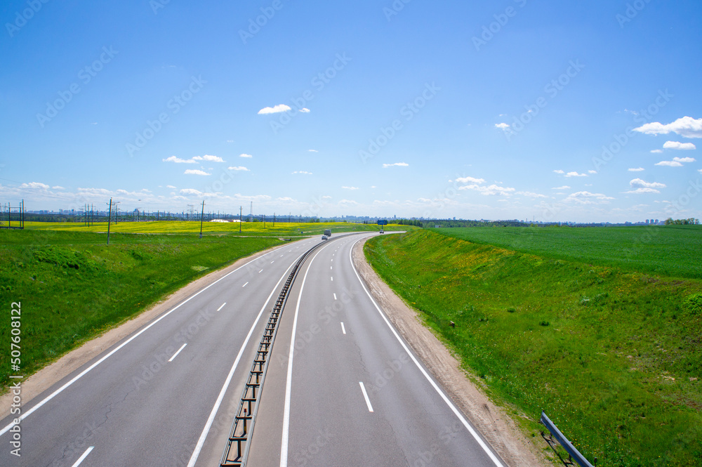 Fototapeta premium Beautiful landscape with road and highway on a sunny day. 25 May 2020, Minsk, Belarus