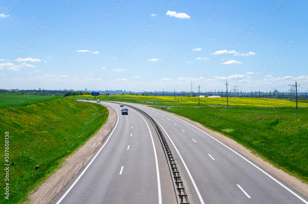 Fototapeta premium Beautiful landscape with road and highway on a sunny day. 25 May 2020, Minsk, Belarus