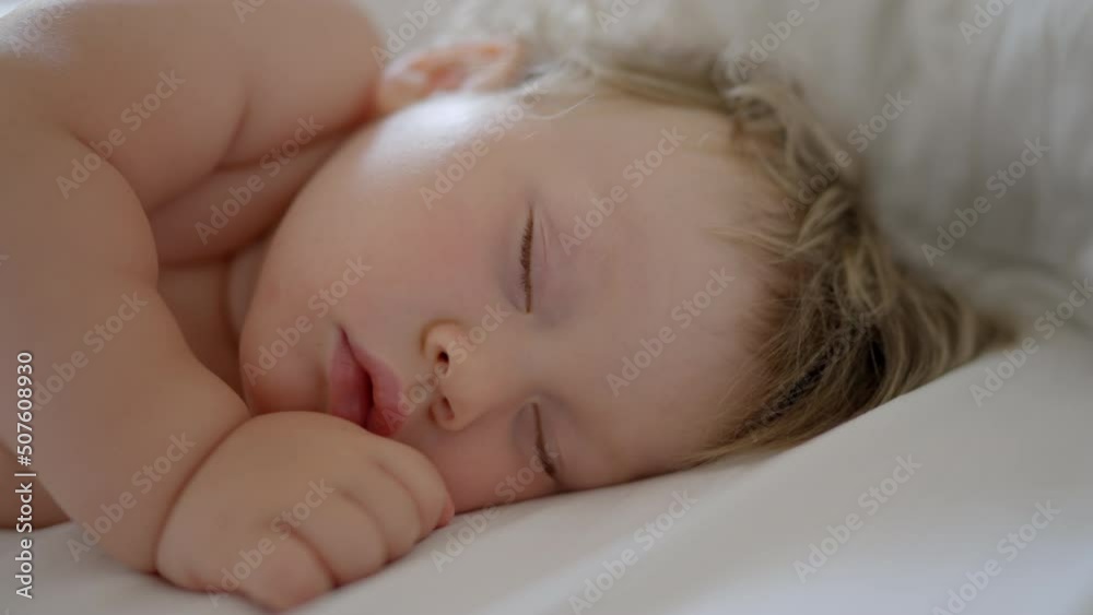 Peaceful baby boy sleeping bed in room. One year-old babyboy sleep home cute little toddler sleeps sweetly in crib sees colorful dream Sleeping baby happy and carefree in bed. Happiness sleep children Peaceful baby boy sleeping bed in room. One year-old babyboy sleep home cute little toddler sleeps sweetly in crib sees colorful dream Sleeping baby happy and carefree in bed. Happiness sleep children