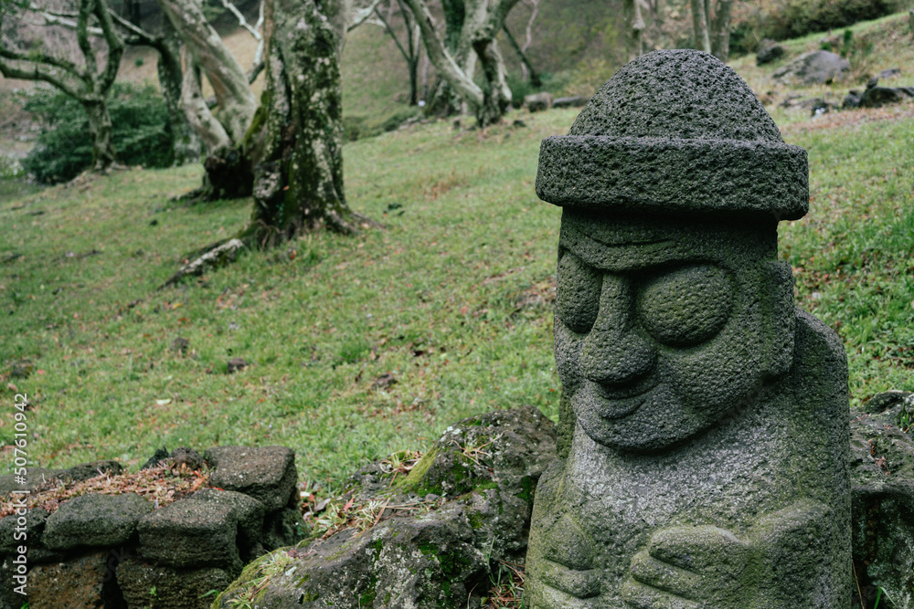 Dol hareubang stone grandpa sculpture at Halla Arboretum in Jeju Island, Korea Dol hareubang stone grandpa sculpture at Halla Arboretum in Jeju Island, Korea