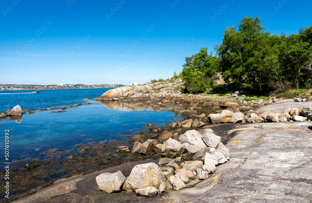 A small scenic rocky bay on a tourist route along fjord to Lifjel mountain, Sandnes, Norway, May 2018