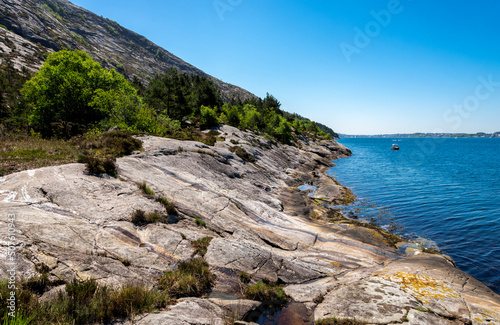 Lifjel rocky coast at Gandsfjord fjord while hiking in a sunny summer day, Sandnes, Norway, May 2018