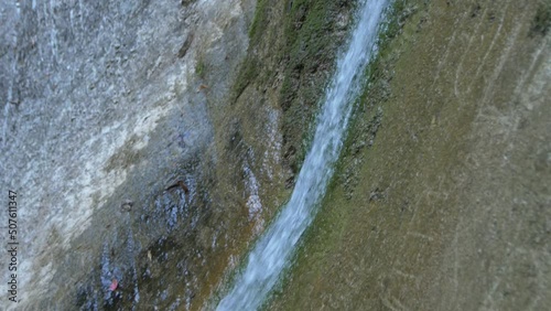  Thin Stream of Water Flows Down the Stone
