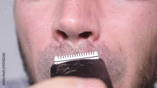 Man Shaves His Nostrils.  Slowmotion
