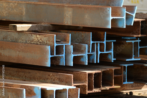 A heap of steel beams with a blue markings on a construction site in Berlin-City.