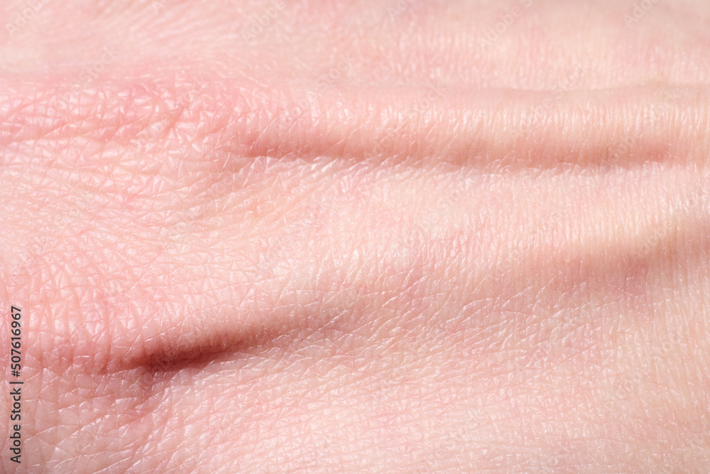 background of a pink skin texture. Healthy skin. Macro photo of skin cells.