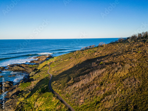 Aerial sunset view of ocean and hills