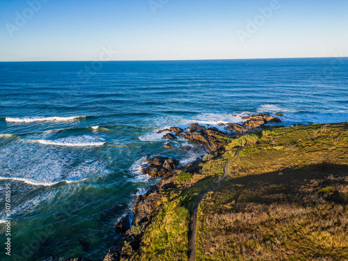 Aerial sunset view of ocean and hills