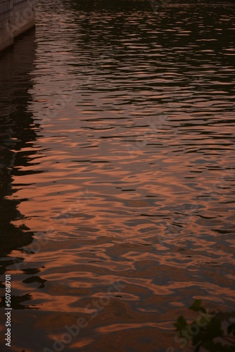 Reflections of the sunset in the water of the old town canal