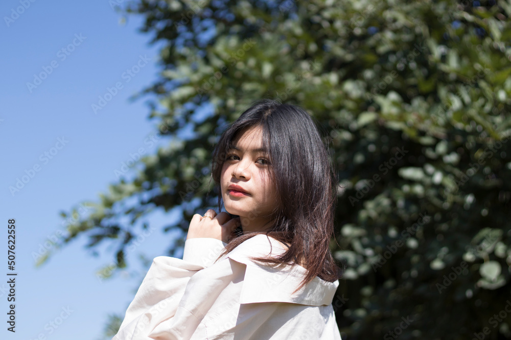 Portrait Young woman outdoors looking at camera. Portrait Young woman outdoors looking at camera.