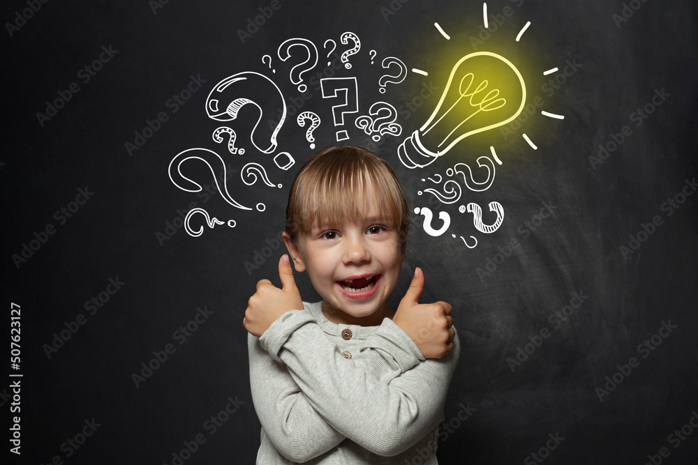 Child girl school student with yellow lightbulb. Kid ideas and development concept Child girl school student with yellow lightbulb. Kid ideas and development concept