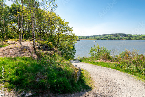 Obraz na płótnie A gravel walking path running downhill to Halandsvatnet lake, Stavanger, Norway, May 2018 w salonie