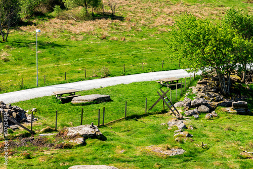 Obraz na płótnie Picnic tables next to a gravel walking path around Halandsvatnet lake, Stavanger, Norway, May 2018 w salonie