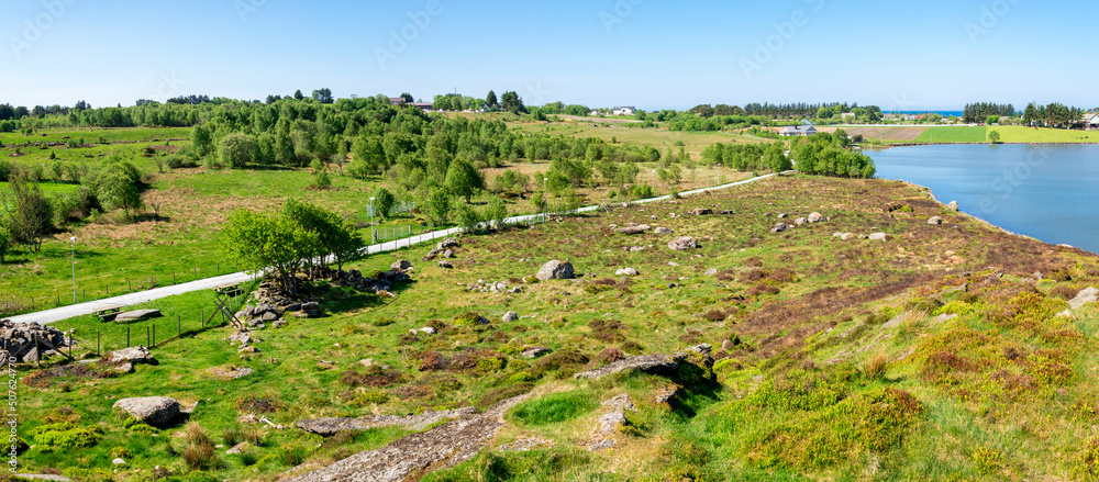 Panorama of the countryside near Halandsvatnet lake with a remote sea view on a horizon, Stavanger, Norway, May 2018