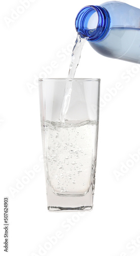 Water pouring into the clear glass isolated on white background