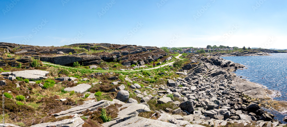 Panorama of a coastline in Kvernevik suburb with a walking footpath, Stavanger, Norway, May 2018