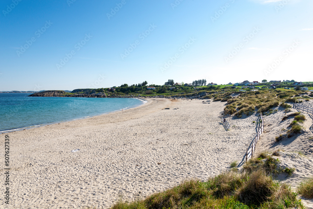 Beautiful Olberg beach with shallow water safe for kids swimming in beginning of summer season, Stavanger, Norway, May 2018
