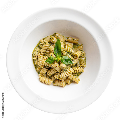 Isolated portion of pesto fusilli pasta on white background