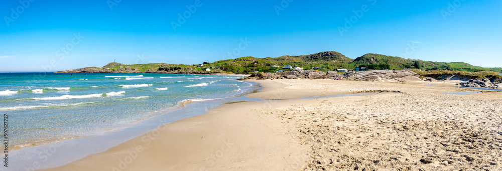 Panorama of Hellesto beach and nearby coast with green hills, Stavanger, Norway, May 2018