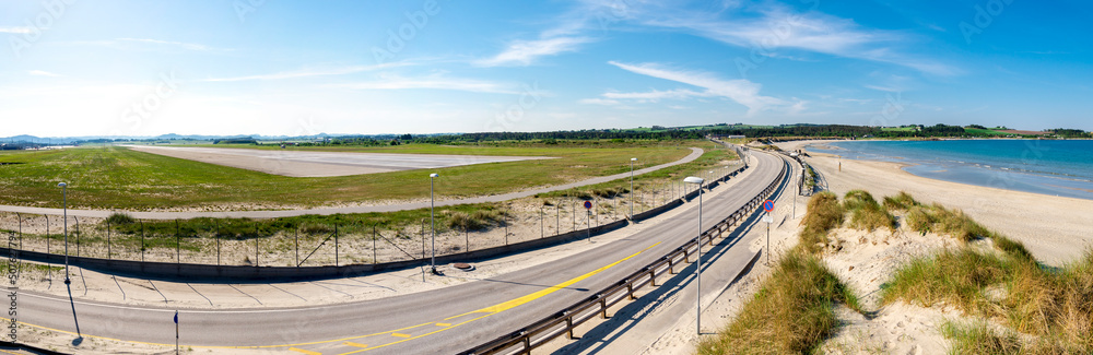 A panoramic view to Stavanger airport airstrip and highway from Solastranden beach, Stavanger, Norway, May 2018