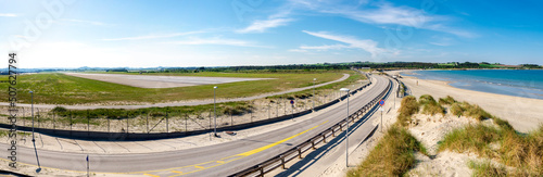 Obraz na płótnie A panoramic view to Stavanger airport airstrip and highway from Solastranden beach, Stavanger, Norway, May 2018 w salonie