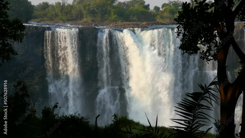The great Victoria falls waterfall in Zimbabwe at the border with Zambia. New 7 Natural Wonders of the World. Mosi-oa-Tunya on river Zambezi. The great Victoria falls waterfall in Zimbabwe at the border with Zambia. New 7 Natural Wonders of the World. Mosi-oa-Tunya on river Zambezi.