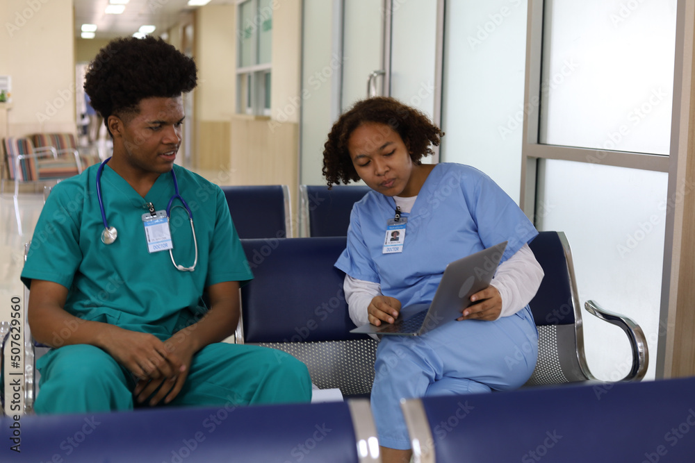 Happiness medical students sitting at hospital. Happiness medical students sitting at hospital.