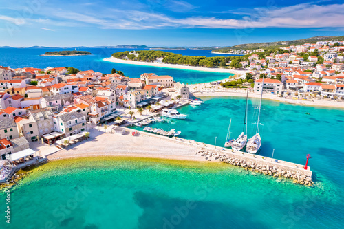 Adriatic tourist town of Primosten turquoise beach and seafront aerial view photo