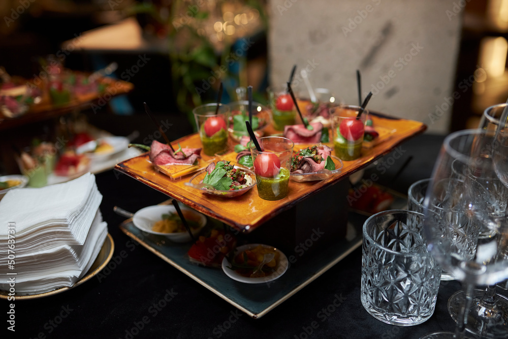 Delicious appetizers, sliced jamon, vegetables and flatbread .snacks 