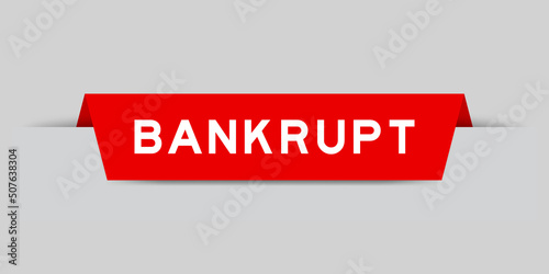 Red color inserted label with word bankrupt on gray background