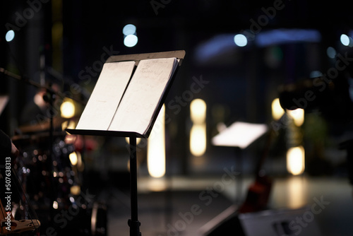 music stand with musical score on a blurred background. musical score on a music stand, close-up 