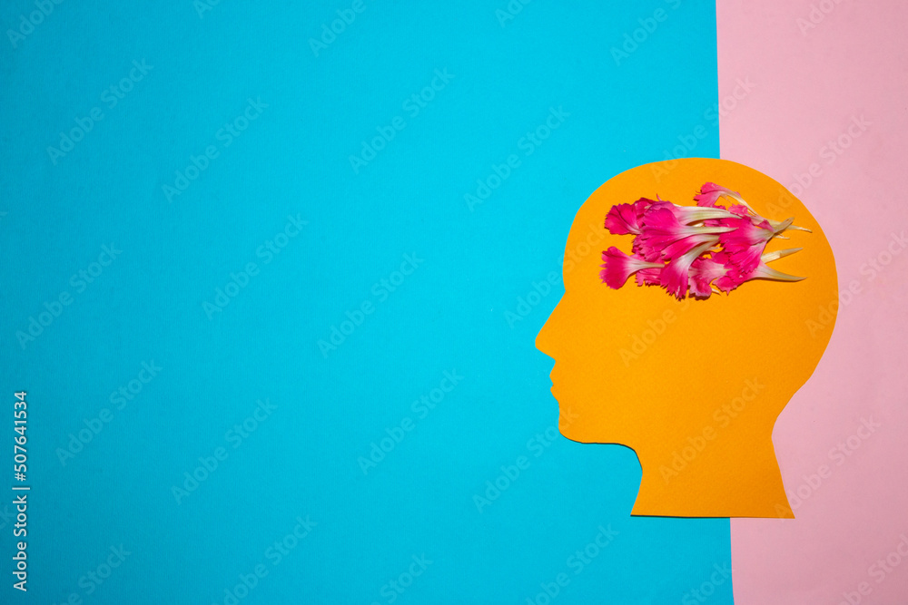 orange head with a brain of pink petals on a blue-pink background, creative thinking, creating ideas in the head orange head with a brain of pink petals on a blue-pink background, creative thinking, creating ideas in the head