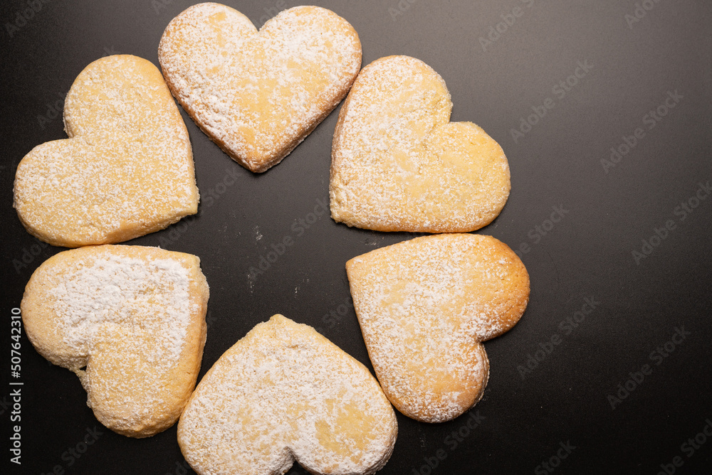 Shortbread in the shape of a heart isolated on white background. Shortbread in the shape of a heart isolated on white background.