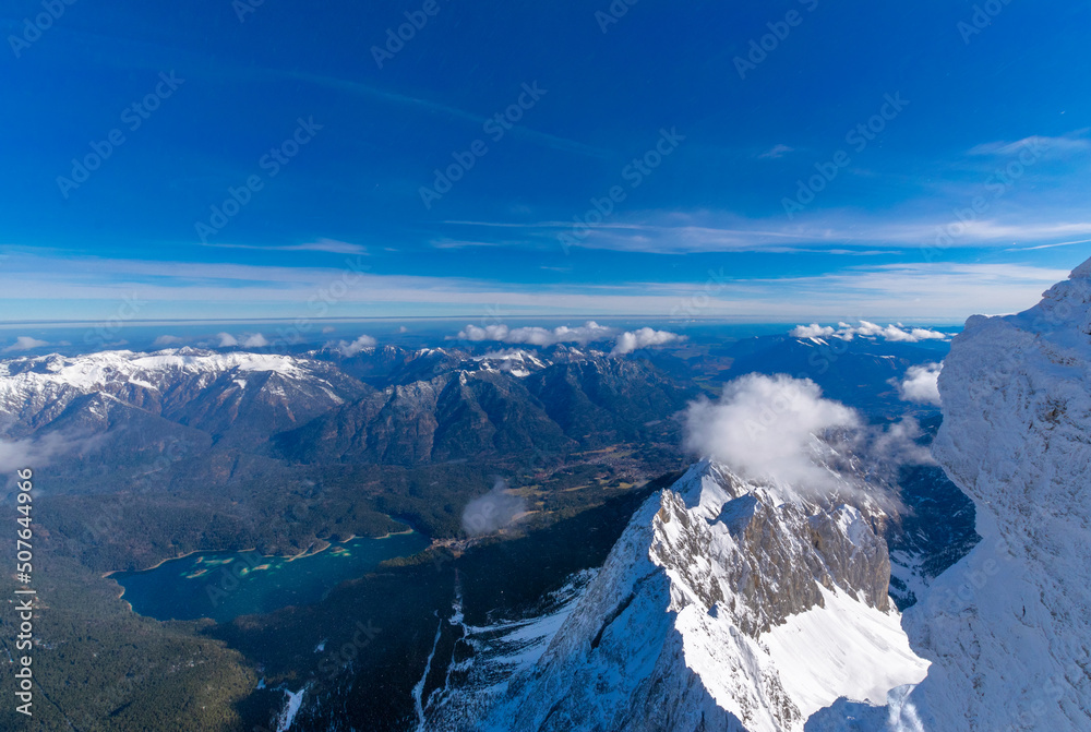 View from the Zugspitze to the surrounding mountain peaks and Eibsee (Tyrol, Austria/ Bavaria, Germany)