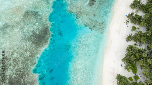 Aerial view beautiful beach forest ocean sea, Tropical island forest and emerald clear water, Tropical island with limestone rocks and turquoise clear water coral reef.