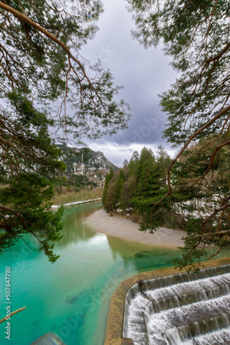 deep turquoise blue river at the Lechfall in F  ssen  Austria