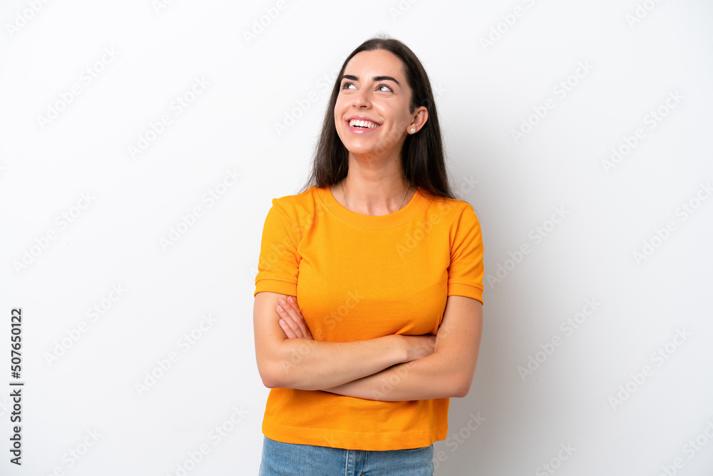 Young caucasian woman isolated on white background looking up and with surprised expression