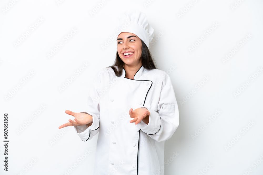 Young chef woman over white background with surprise facial expression Young chef woman over white background with surprise facial expression