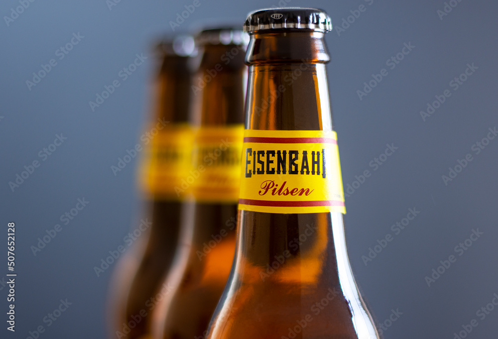 Studio photo of Eisenbahn Pilsen beer, a popular brand sold around the