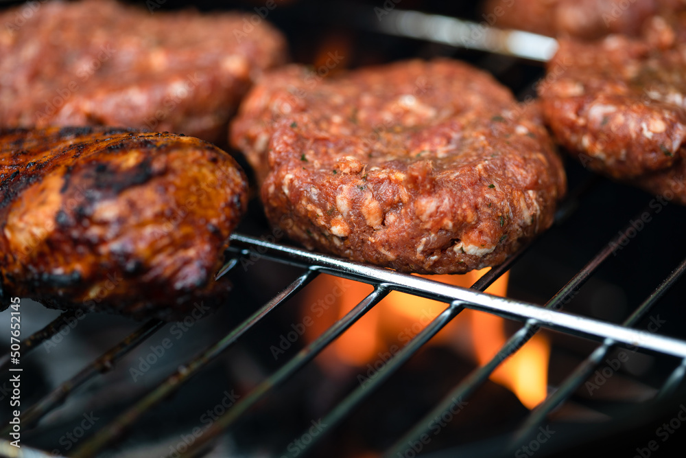 Beef burgers on the grill Beef burgers on the grill