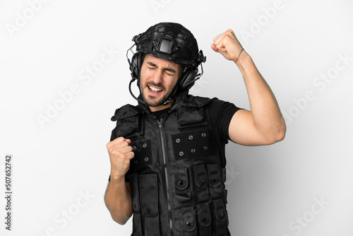 Konstfotografi Young caucasian swat isolated on white background celebrating a victory