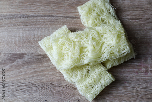 rice noodles isolated on wooden background