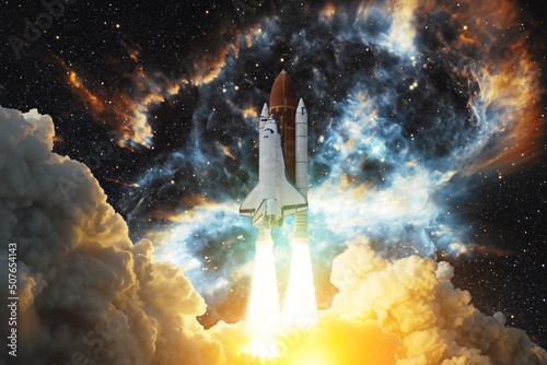 Spaceship flight. Space shuttle with smoke and blast takes off into the starry sky and clouds of gas or dust in space. Rocket starts into nebula. Concept. Elements of this image furnished by NASA.