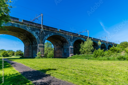 A view towards the fourteen arches viaduct at Wolverton, UK in summertime photo