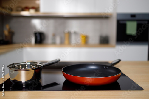 Frying pan and sauce pan on modern induction cooktop